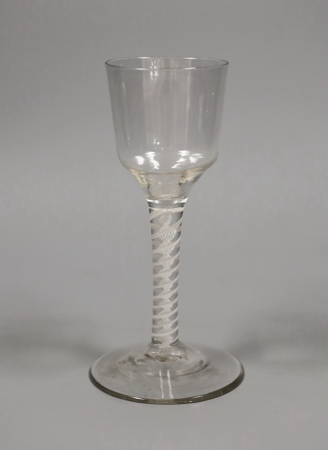 An 18th century double series opaque twist stem wine glass, 16cm tall